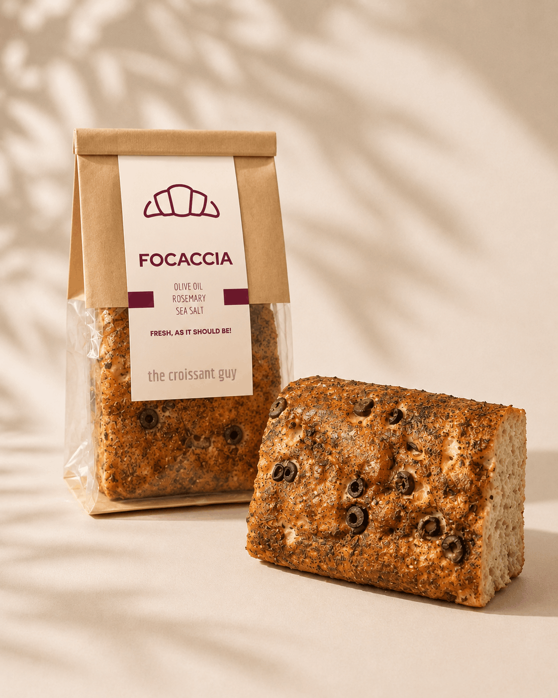 Freshly baked focaccia bread with a golden crust and soft airy texture at The Croissant Guy Karachi
