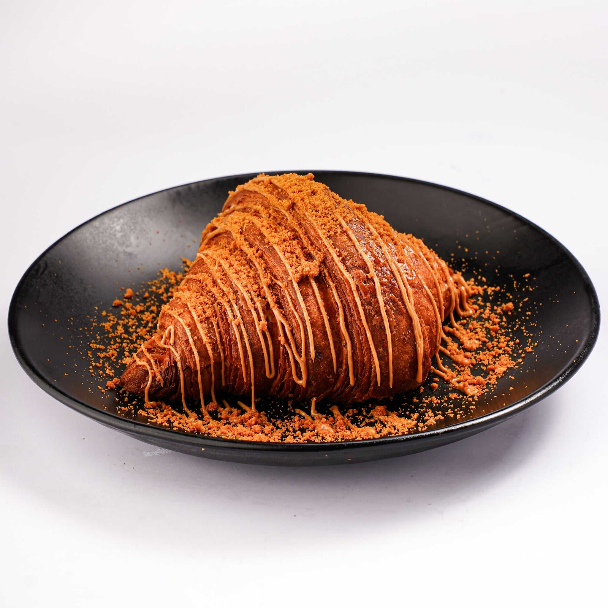 Lotus biscoff croissant topped with lotus spread freshly baked at The Croissant Guy Karachi